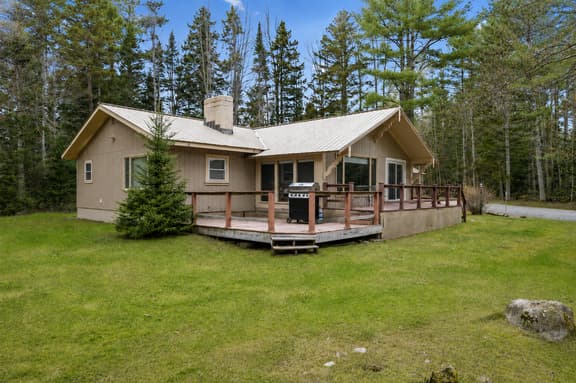 Private woodland cabin with wraparound deck and outdoor grill
